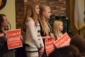 Leilani Holmstadt's daughters stand in support of their mother.
