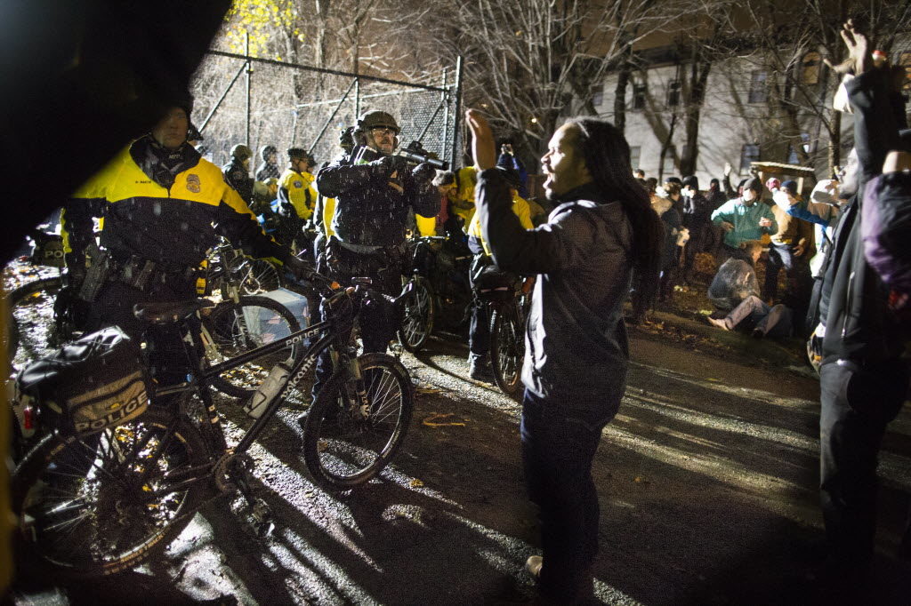 Protesters and police face off during the Jamar Clark protests in Minneapolis. City Pages photo.