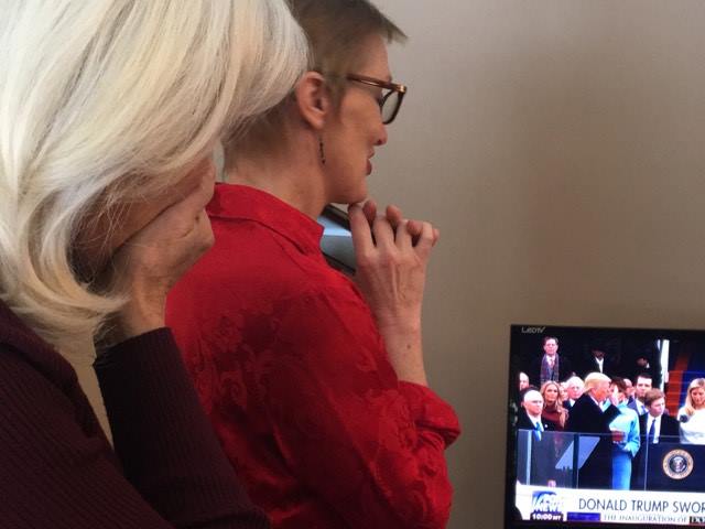 Supporters Mary Ellen Moore and Heather Joyner Mastad look on in awe as President Trump is sworn in.