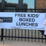 A sign announces free lunches at Manager Restaurant & Wine Bar.