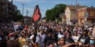Protestors gathered outside the Police & Fire Unions' offices. (Image credit: Twitter/Evan Frost)