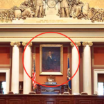 A painting of Abraham Lincoln hangs behind the podium in the Minnesota State House chambers.