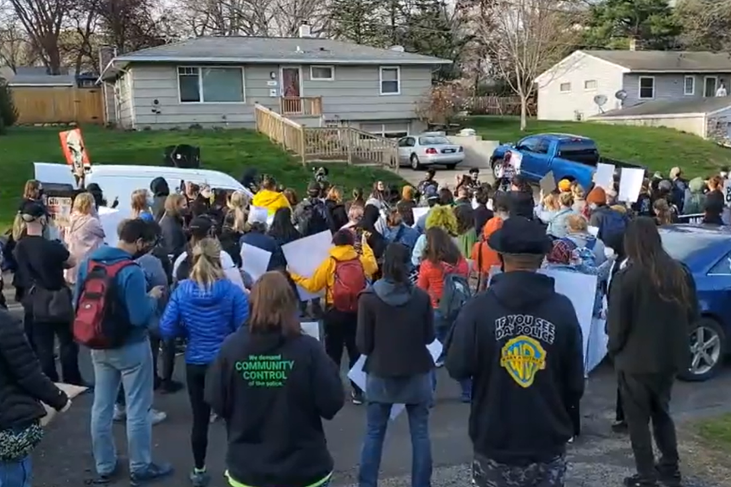 A group of protestors listen to a speech outside the home of the Washington County Attorney. (Image source: Facebook/BackLives-Media)