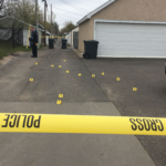 Police mark some of the casings from the shooting. (Michael Tracey/Twitter)