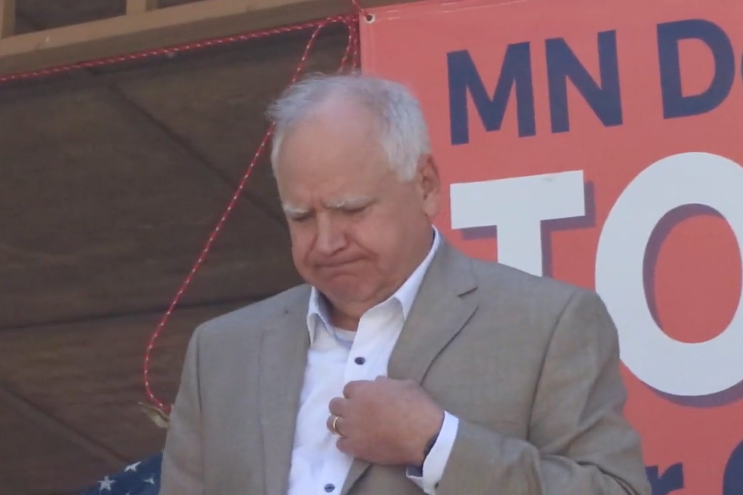 Walz looks dismayed on stage at Saturday's event. (Twitter/Screenshot)