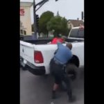 A St. Paul officer is dragged behind a truck. (YouTube/Crime Watch Minneapolis)