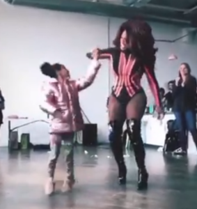 Drag performer Zon Legacy Phoenix dances with a child. (Facebook/ZonLegacyPhoenix)