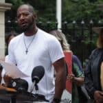Thompson speaks at a rally outside the governors mansion in St. Paul in July 2021. (Alpha News)