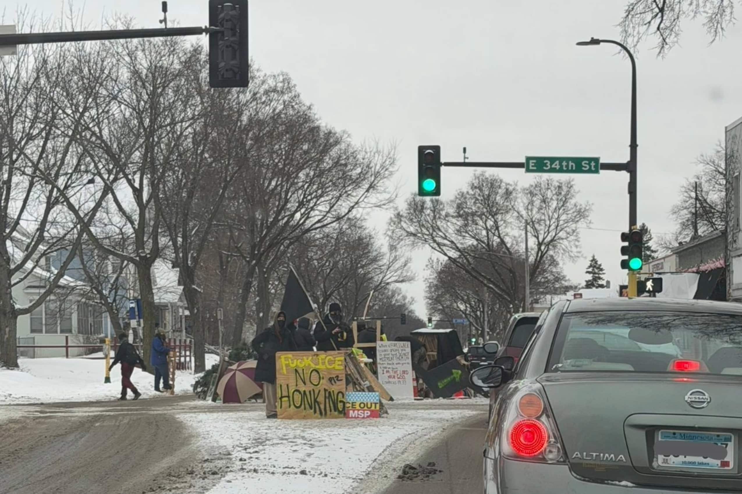 Anti-ICE agitators set up blockade on Minneapolis street, check drivers' license plates | AlphaNews.org