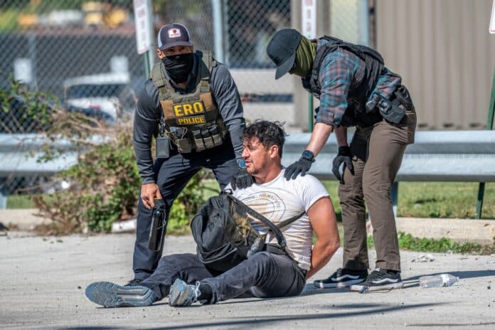 Immigration agents detain a man during a protest outside an ICE processing center in Broadview, Illinois, in September 2025.