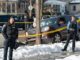 Minneapolis police officers stand by the scene where Renee Good was killed in January 2026.