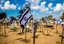 Re'im, Israel – Jan. 5, 2024: A memorial composed of photos of young Israelis killed during the Hamas terrorist attack on the NOVA Festival which took place on October 7, 2023.