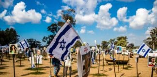 Re'im, Israel – Jan. 5, 2024: A memorial composed of photos of young Israelis killed during the Hamas terrorist attack on the NOVA Festival which took place on October 7, 2023.