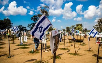 Re'im, Israel – Jan. 5, 2024: A memorial composed of photos of young Israelis killed during the Hamas terrorist attack on the NOVA Festival which took place on October 7, 2023.