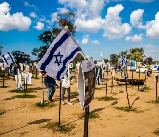 Re'im, Israel – Jan. 5, 2024: A memorial composed of photos of young Israelis killed during the Hamas terrorist attack on the NOVA Festival which took place on October 7, 2023.