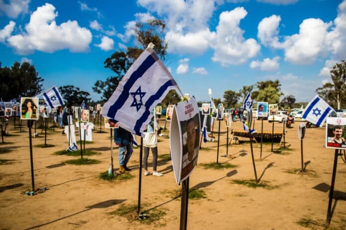 Re'im, Israel – Jan. 5, 2024: A memorial composed of photos of young Israelis killed during the Hamas terrorist attack on the NOVA Festival which took place on October 7, 2023.