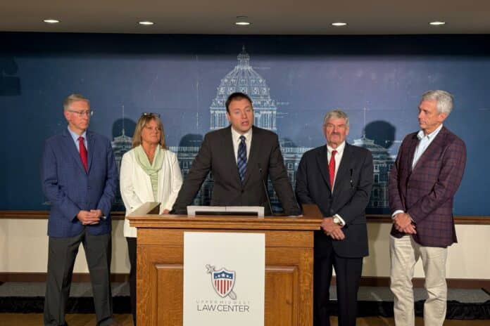 Nicholas Nelson, senior appellate counsel at the Upper Midwest Law Center, speaks at a press conference.