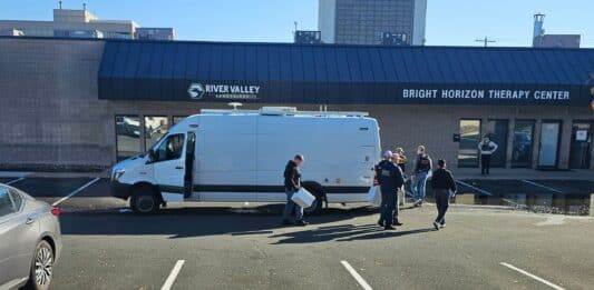 Law enforcement officers carry boxes out of Bright Horizon Therapy Center Oct. 29, 2026.