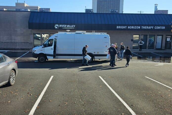 brighthorizon-1 Law enforcement officers carry boxes out of Bright Horizon Therapy Center Oct. 29, 2026.