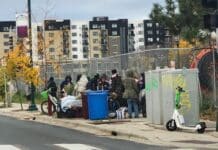 A crowd recently loitering on 1st and East Lake Street.