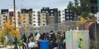 A crowd recently loitering on 1st and East Lake Street.