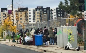 A crowd recently loitering on 1st and East Lake Street.