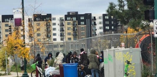 A crowd recently loitering on 1st and East Lake Street.