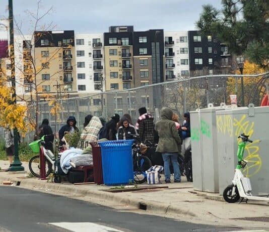A crowd recently loitering on 1st and East Lake Street.