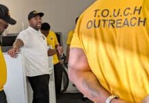 Muhammad Abdul-Ahad, the founder of T.O.U.C.H. Outreach in Minneapolis, meets with his group of "violence interrupters" before they canvassed crime-prone areas of the city on a recent day.