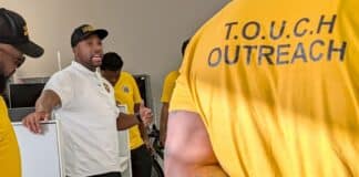 Muhammad Abdul-Ahad, the founder of T.O.U.C.H. Outreach in Minneapolis, meets with his group of "violence interrupters" before they canvassed crime-prone areas of the city on a recent day.