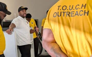 Muhammad Abdul-Ahad, the founder of T.O.U.C.H. Outreach in Minneapolis, meets with his group of "violence interrupters" before they canvassed crime-prone areas of the city on a recent day.