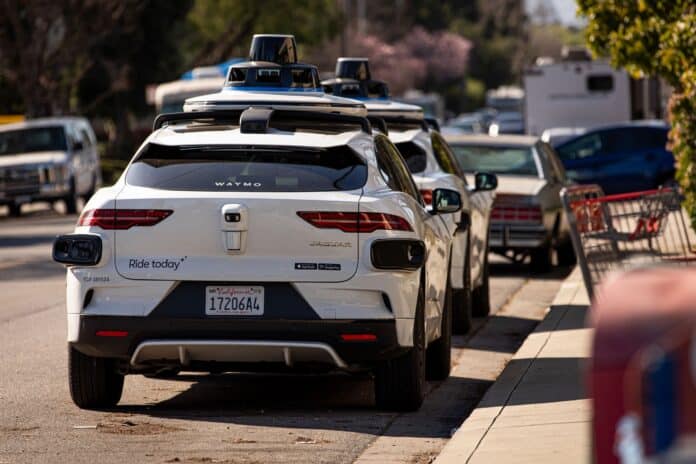 waymo (1) Waymo cars parked along a street in Mountain View, Calif.